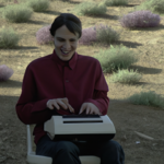 a happy person using a word processor outside